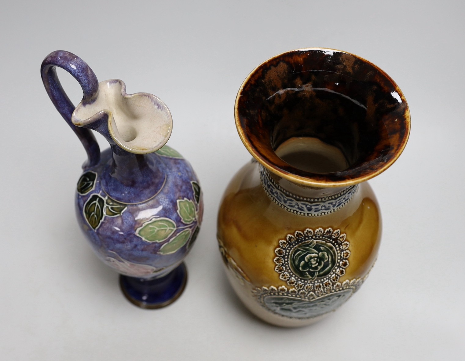 A Doulton stoneware vase and jug, tallest 28cm, together with three art ceramic bowls